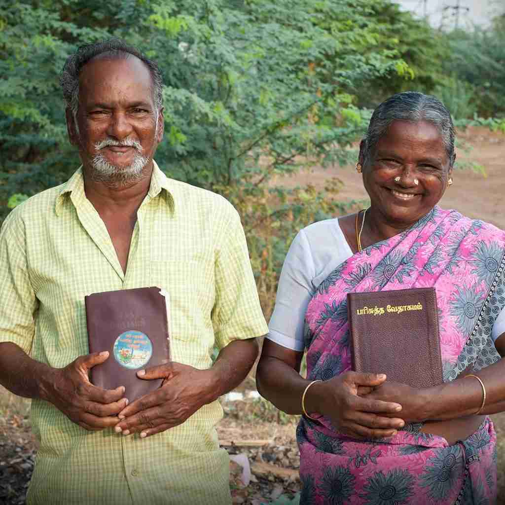 Man and woman receive Bibles