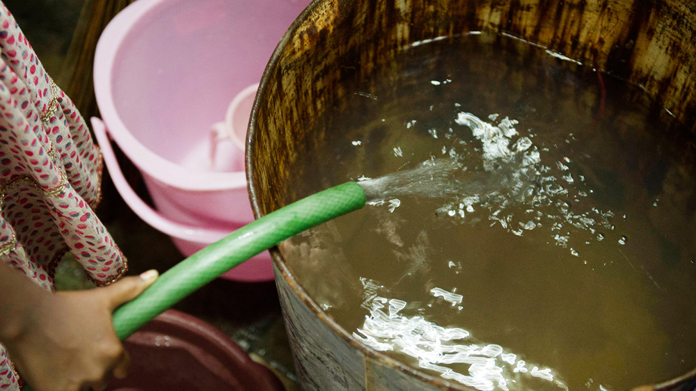 Drum being filled up with dirty water
