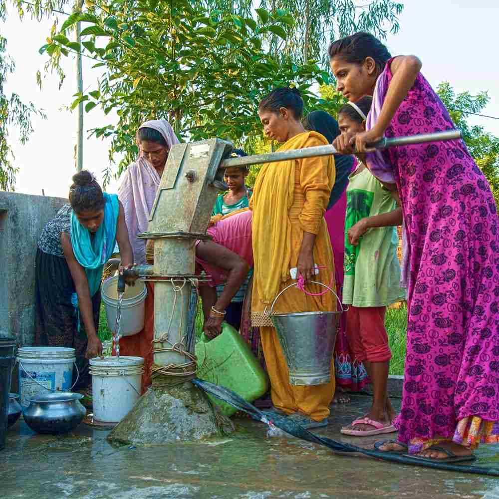 Village fills up their buckets with clean water from Jesus Well