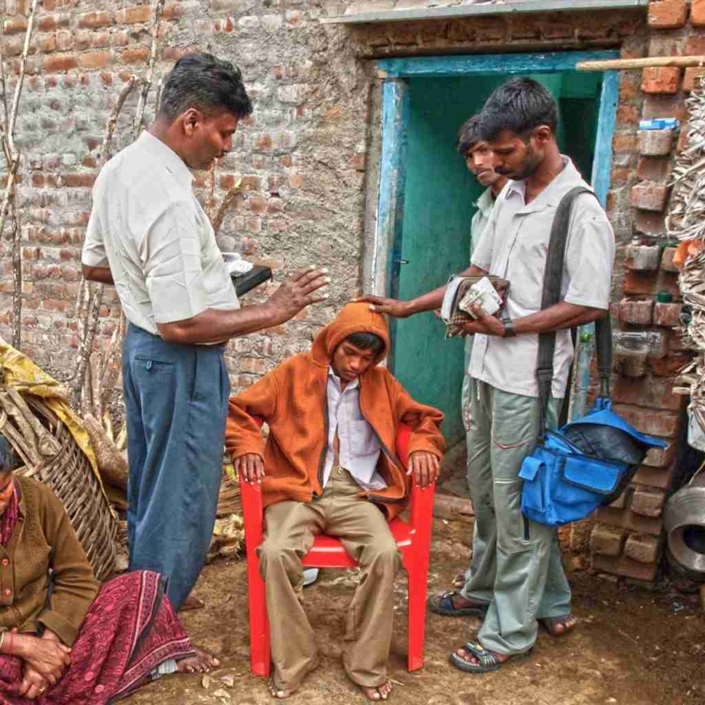 National missionaries praying for sick boy