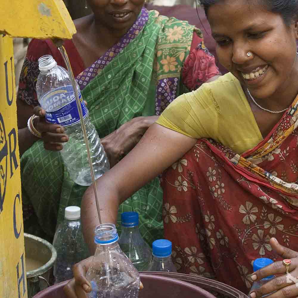 This BioSand Water Filter brings joy and clean water to this woman and her whole village