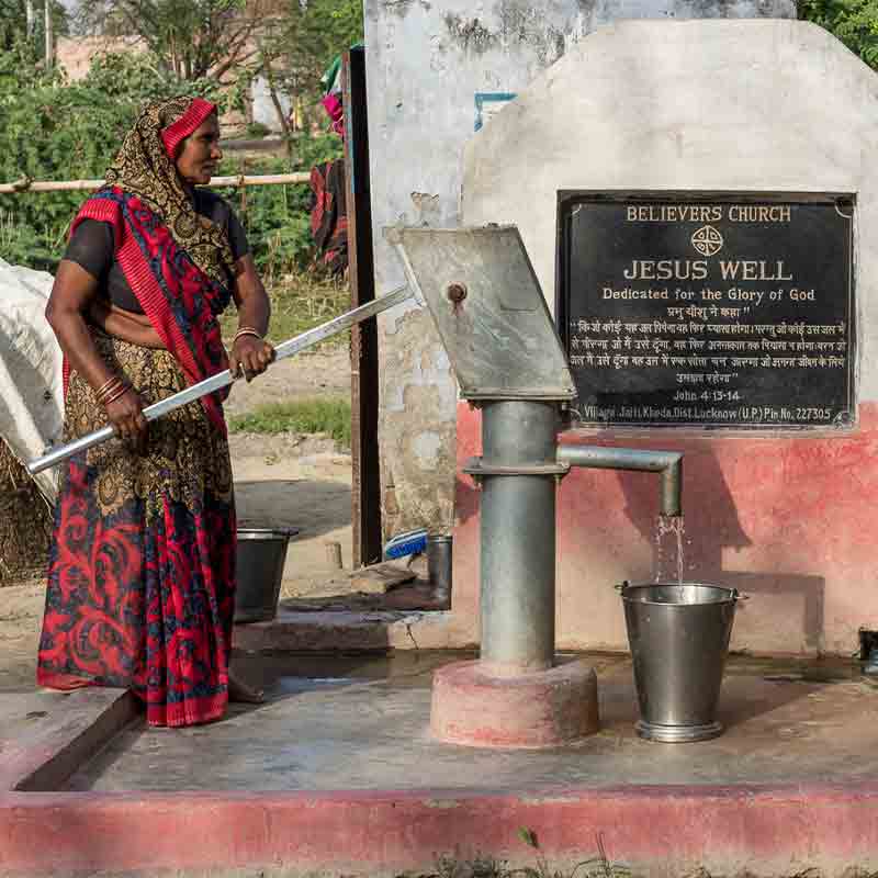 This is a Jesus Well in a remote village in Asia. It’s the only well within easy walking distance to this village. People use the water for drinking, bathing, watering crops and livestock, … They hand pump the water into buckets and haul it away pretty much all day long.