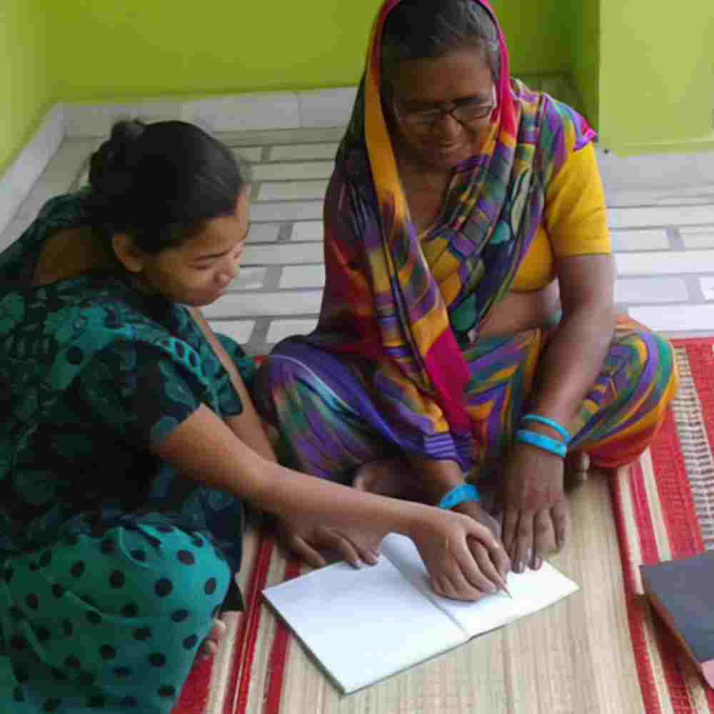 Jeni learns how to read, write and do basic math, through GFA World women's adult literacy class