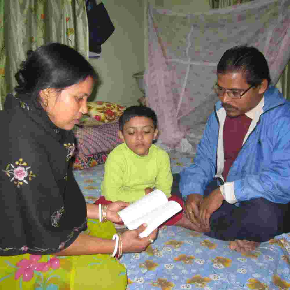 Family is able to read God's Word, the Bible, through literacy
