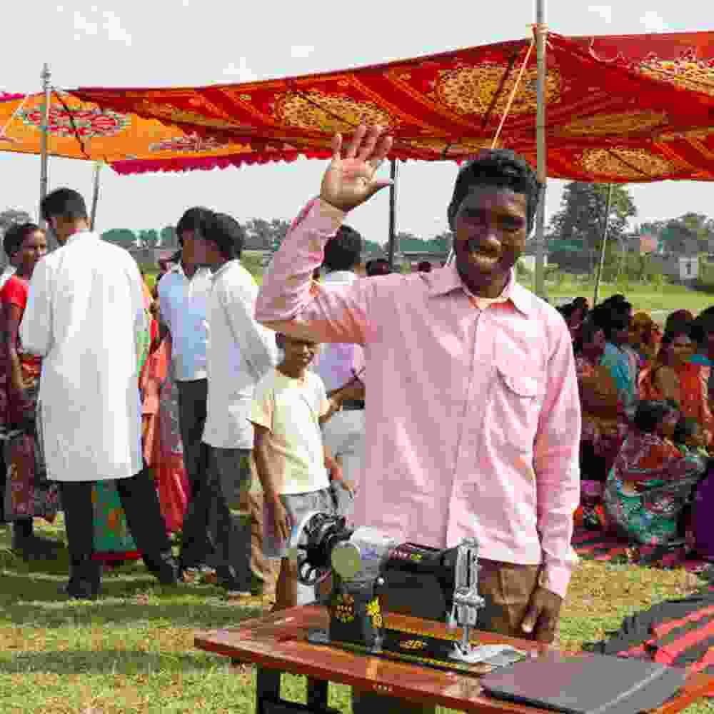 Man received an income generating gift of a sewing machine from GFA World gift distribution