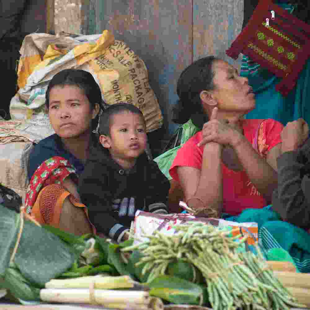 Family in poverty working at the market
