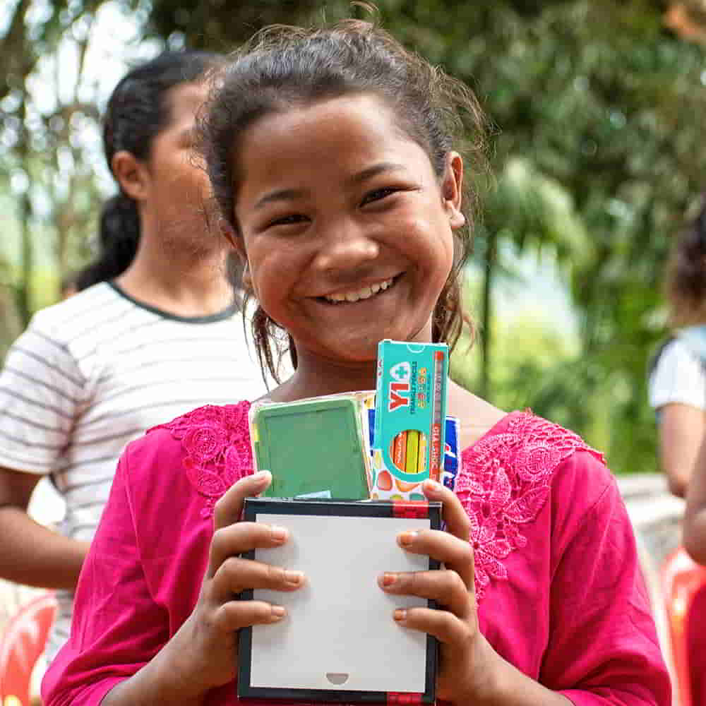 Girl received school supplies from GFA World child sponsorship Bridge of Hope