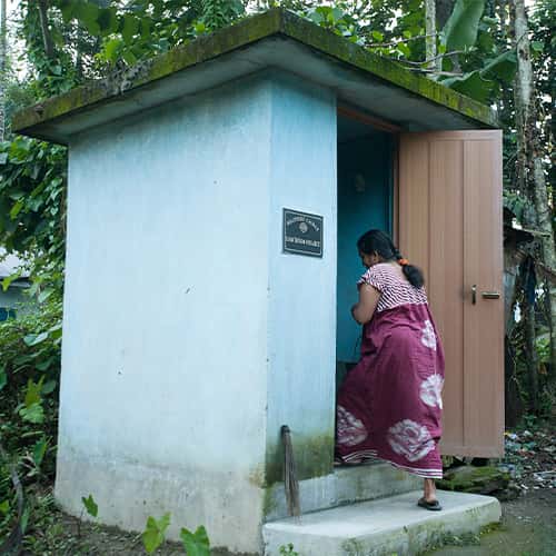 Woman safely uses an outdoor toilet from GFA World