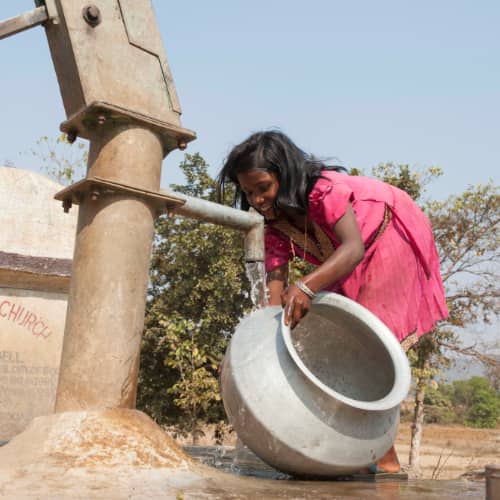 Young girl enjoying clean water through GFA World (Gospel for Asia) Jesus Wells