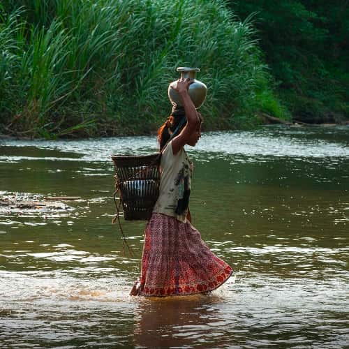 Women and children walk long distances to collect water