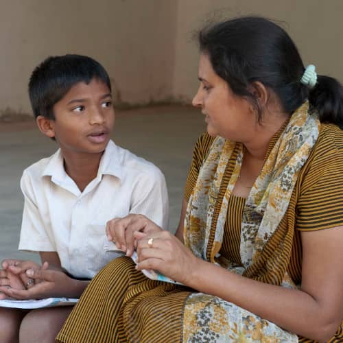 GFA World (Gospel for Asia) child sponsorship program teacher guiding her student