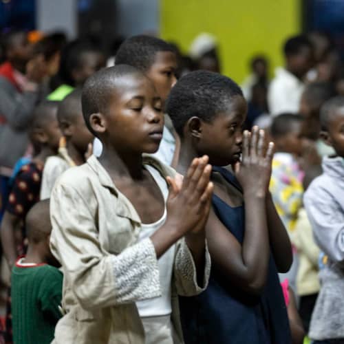 Children from Africa praying in GFA World (Gospel for Asia) church