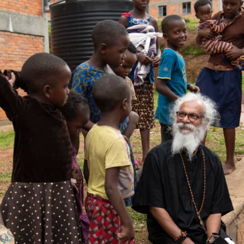 GFA World (Gospel for Asia) founder, KP Yohannan, sharing the love of Jesus to children in Rwanda, Africa