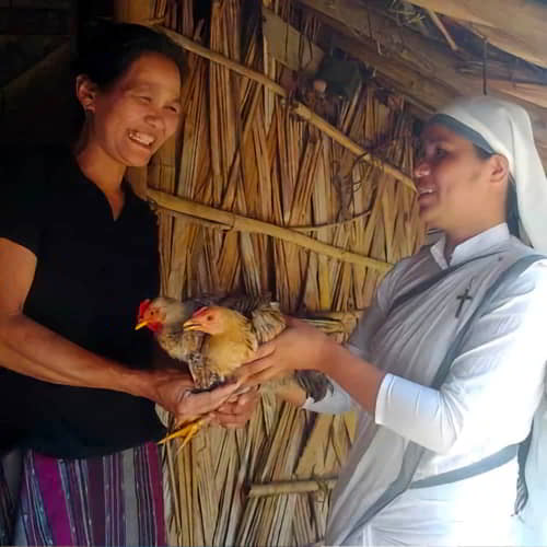 Neha received a pair of income generating chickens through GFA World Sisters of Compassion