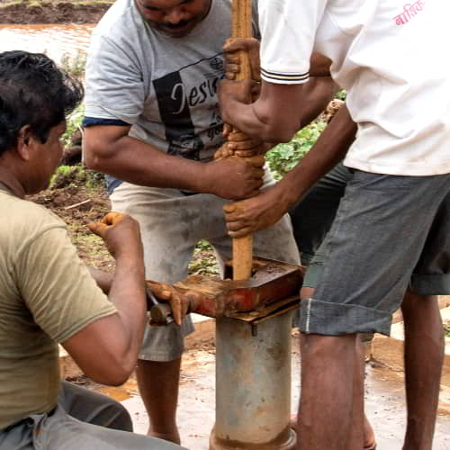 Group of local villagers repairing a Jesus Well provided by GFA World, a clean water organization