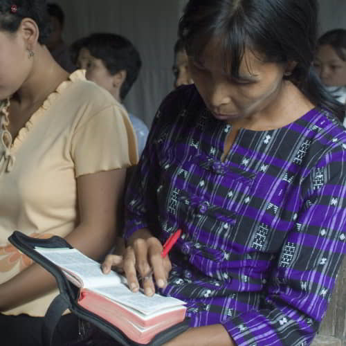 Women in poverty are able to read the Bible through GFA World adult literacy class