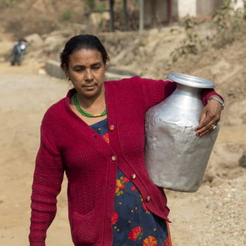 Women walk long distances to acquire water that is often from unsafe sources