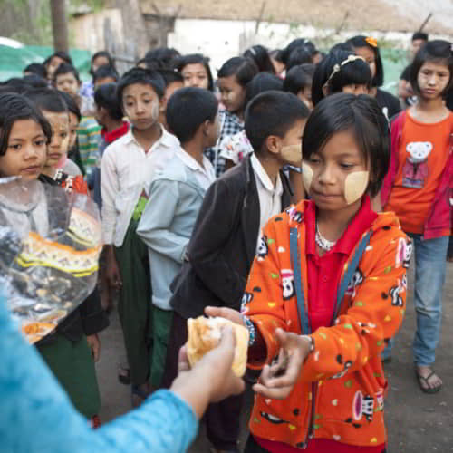 Girls receive nutritious food through GFA World, a boys and girls education charity