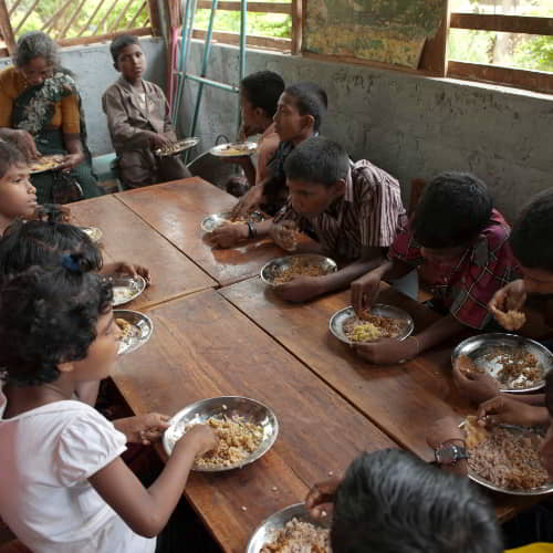 Children enjoy nutritious food from GFA World child sponsorship program