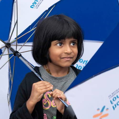 Children in crisis receive umbrellas through GFA World child sponsorship program gift distribution
