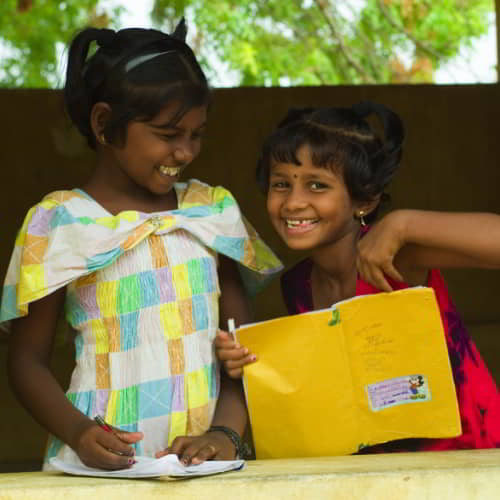 Happy girls gaining an education through GFA World child sponsorship program