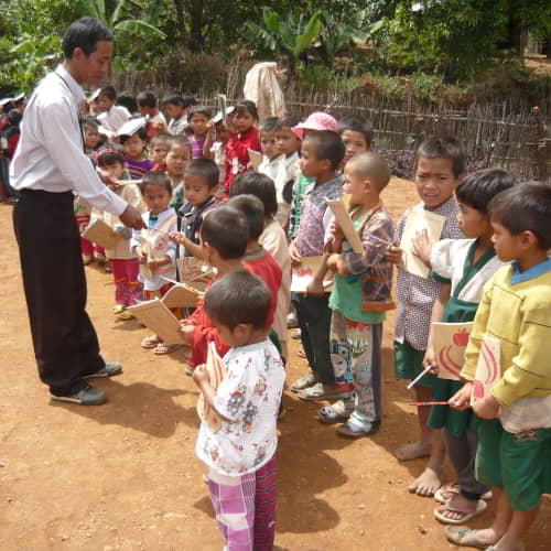 GFA World poverty organization's child sponsorship program distributing gifts of school supplies