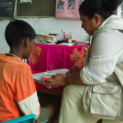 National missionary worker providing counsel to children in GFA World child sponsorship program