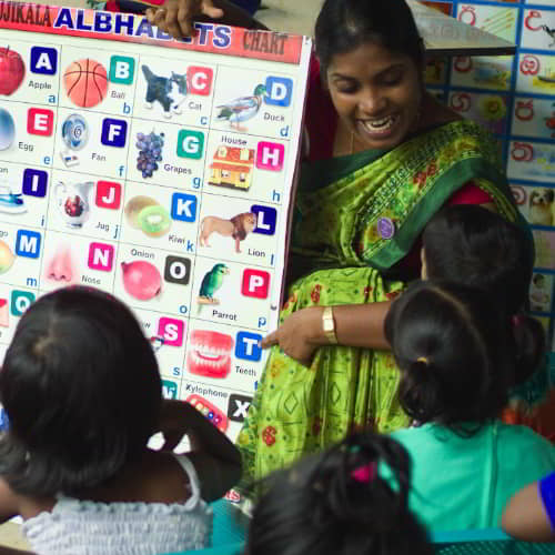 Staff from GFA World child sponsorship program teaching girls