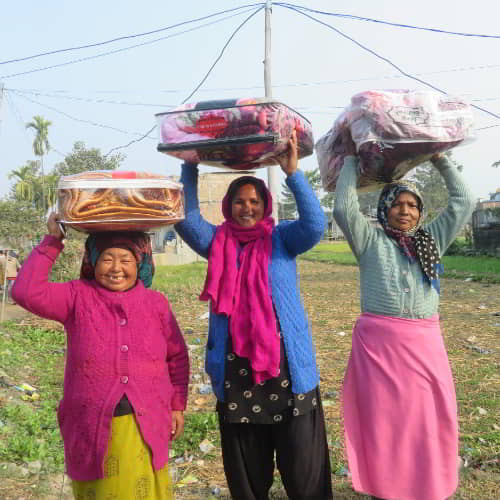 Women received warm blankets from GFA World gift distribution