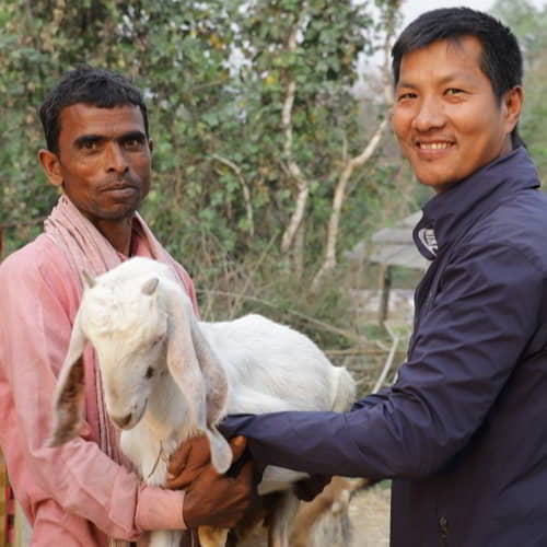 Man in poverty received income generating animals of goats through GFA World gift distribution