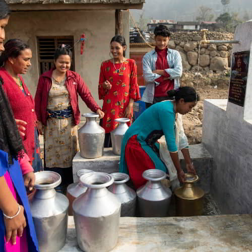 Women drawing clean water through GFA World Jesus Wells