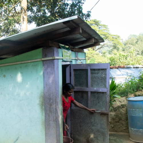 This woman and her family enjoys a sanitation facility through GFA World gift distribution