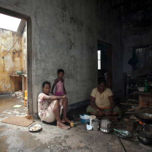 Family in poverty living in a dilapidated house