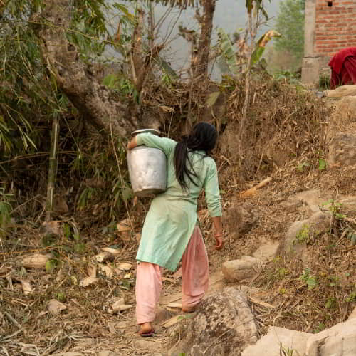 Women and children from South Asia travel long distances to collect water that is often contaminated