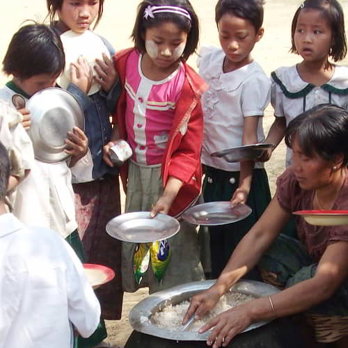 Children receiving healthy food through GFA World child sponsorship program