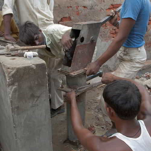 Local villagers doing maintenance work on GFA World Jesus Wells