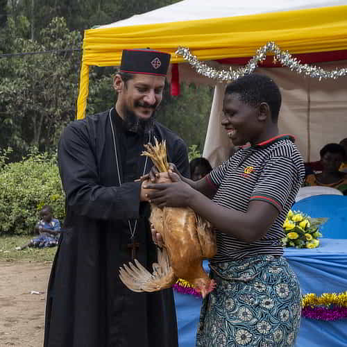 Woman recipient in GFA World distribution of charitable Christmas gifts of chickens