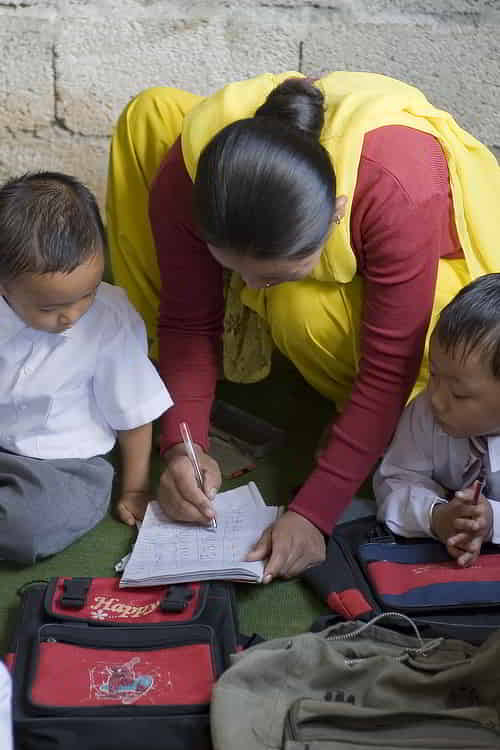 GFA World child sponsorship staff teaching children