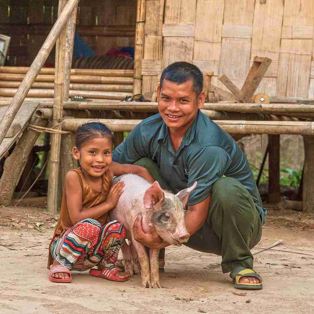 Family receives pig from GFA World Gifts from the Stable