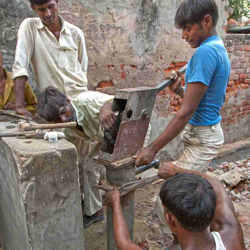 Men repairing Jesus Well