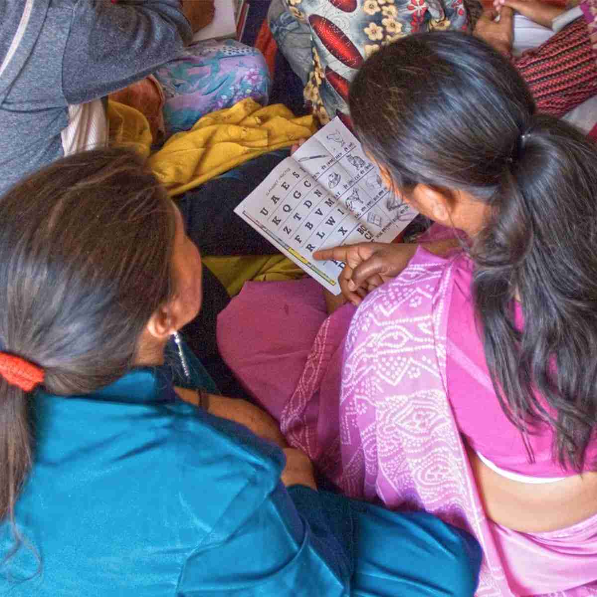 Women learning how to read and write through GFA World Literacy Classes