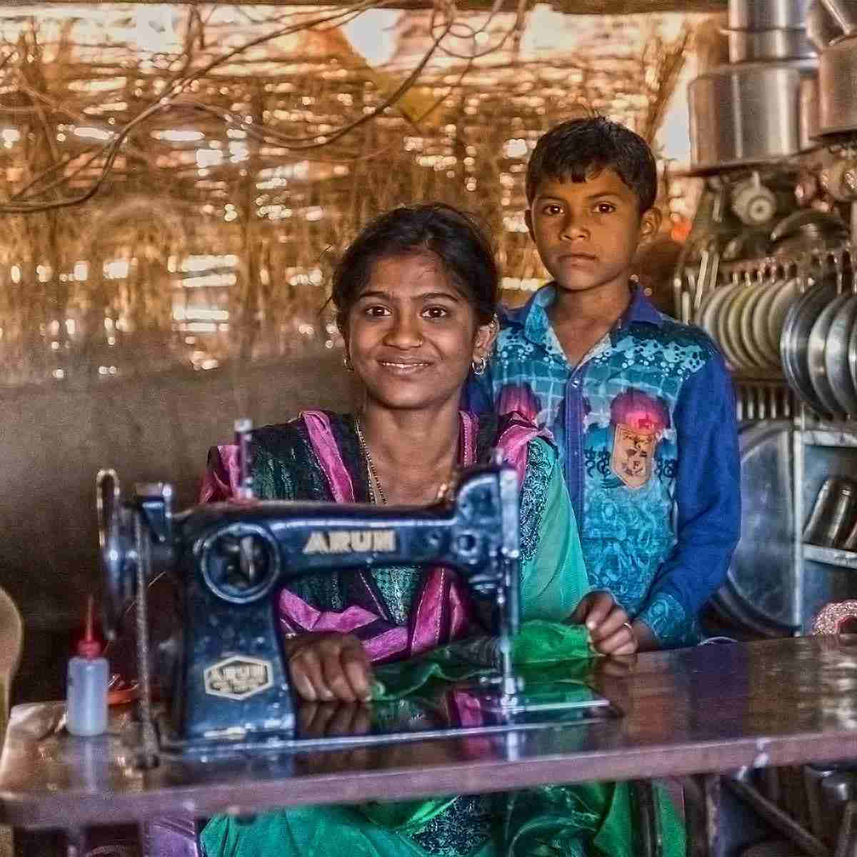 Mother and son blessed with a poverty alleviating sewing machine