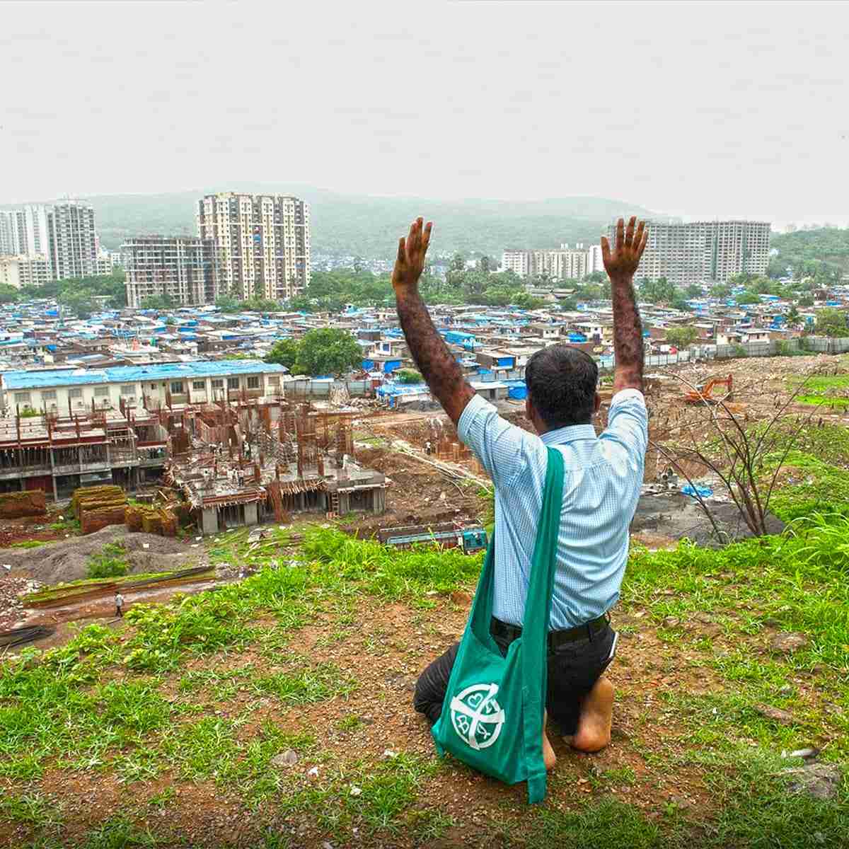 National missionary prays for the people living in the slums