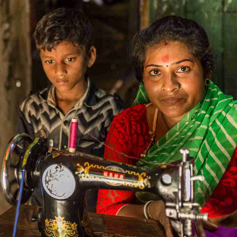 This mother helps provide for her children and family through newly acquired tailoring skills and the gift of a sewing machine.
