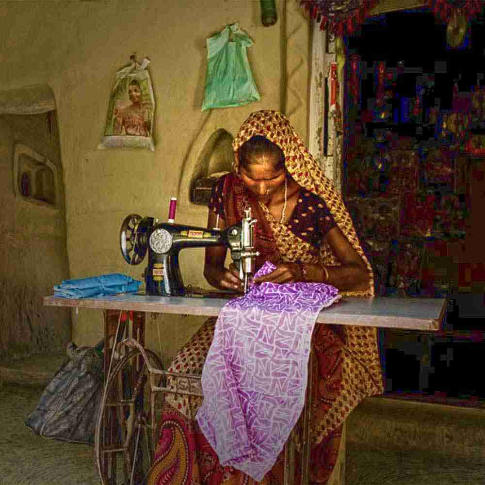This woman in Asia learned how to use a sewing machine to help provide for her family in the fight against poverty.