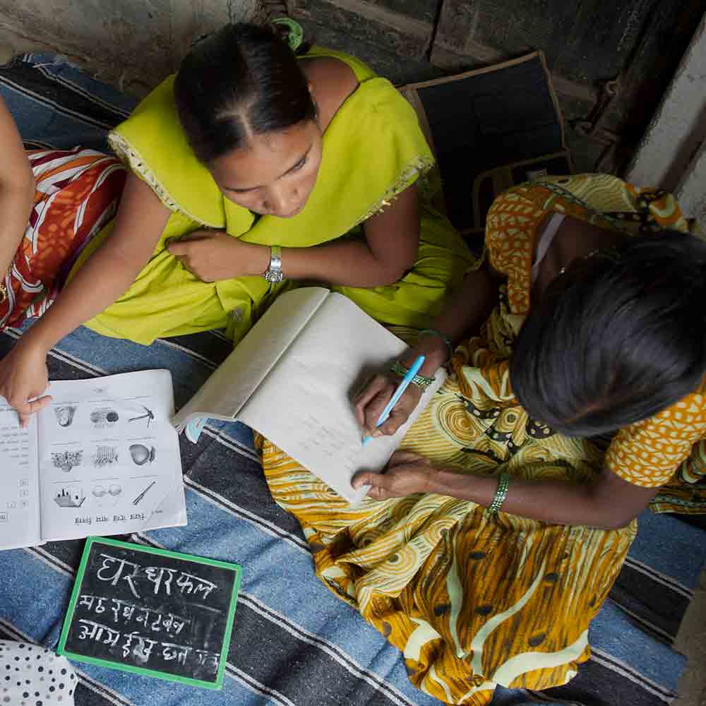 This woman is learning how to read and write from a literacy class