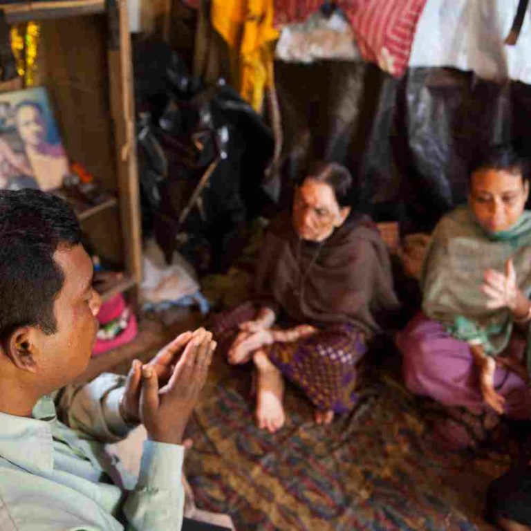 National Missionary Worker Praying For A Family In Poverty Living In ...