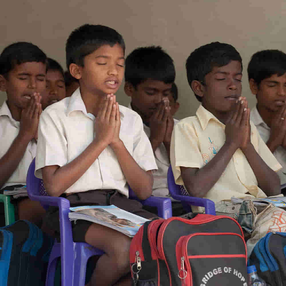 Children taught to pray in GFA World child sponsorship Bridge of Hope