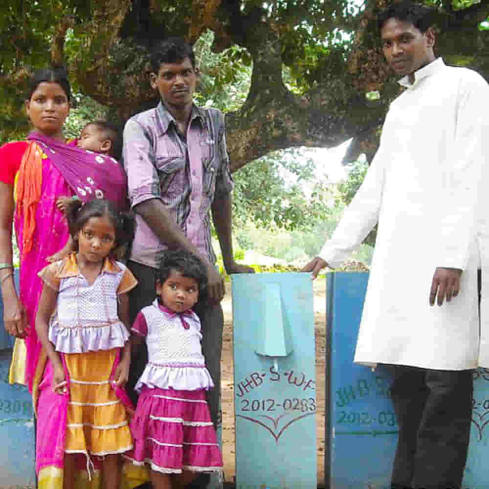 Family receives a BioSand Water filter from GFA World