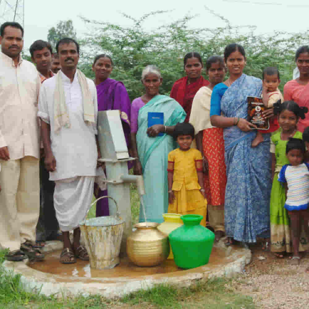 A village community enjoys clean water through GFA World Jesus Wells